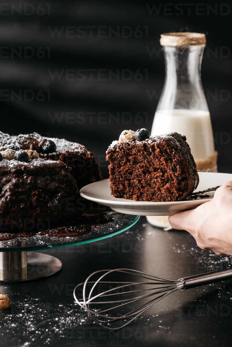 Cup cake with buttercream topping on black background, close up stock photo