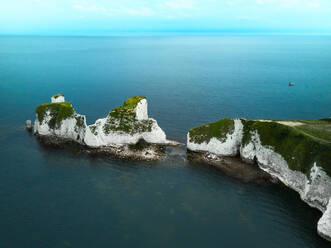 Aerial view of the iconic landmark of Old Harry Rocks and its white cliffs made of chalk in Studland, Dorset, United Kingdom. - AAEF10036