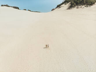 Aerial view of two people walking on Carlo Sandblow, Queensland, Australia. - AAEF10116