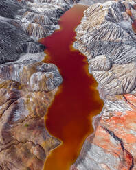 Aerial view of the Martian landscape of industrial production of refractory clays with a red colored water reservoir, Bogdanovich, Sverdlovskaya oblast, Russia. - AAEF10162