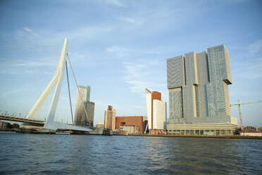 Netherlands, South Holland, Rotterdam, Erasmusbrug with hotel in background - FVDF00344