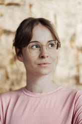 Young woman in eyeglasses looking away - JOSEF05300