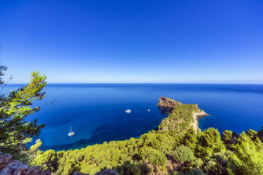 Clear sky over Sa Foradada peninsula and vibrant blue waters of Mediterranean Sea in summer - THAF02995