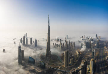 Aerial view of misty Burj Khalifa and surronding skyscapers in Dubai, United Arab Emirates. - AAEF11190