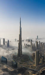 Aerial view of misty Burj Khalifa and surronding skyscapers in Dubai, United Arab Emirates. - AAEF11191