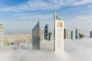Aerial view of misty Emirates Office Tower skyscrapers in Dubai, United Arab Emirates. - AAEF11193