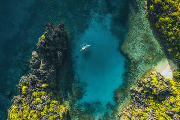 Aerial view of traditional outrigger boat in El Nido, Philippines. - AAEF11198
