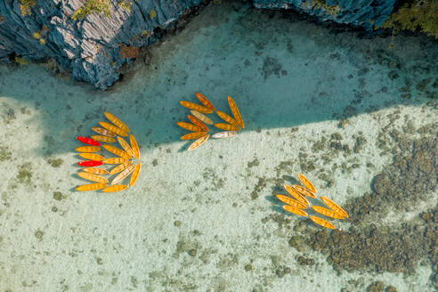 Aerial view of kayaks attached together in pattern in bay of El Nido, the Philippines. - AAEF11236