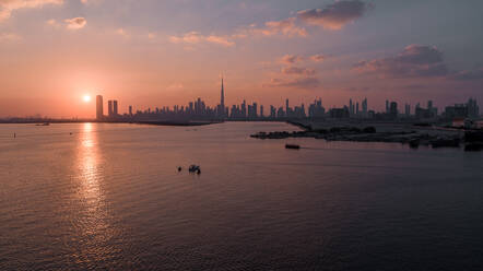 Aerial view of Dubai skyline facing the creek during a beautiful sunset, Dubai, United Arab Emirates. - AAEF11272