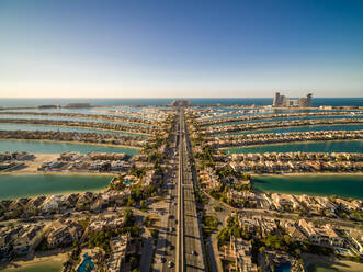 Aerial view of the Palm Jumeirah with Atlantis the Palm luxury hotel in background, an artificial archipelagos in the city centre of Dubai, United Arab Emirates. - AAEF11275