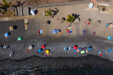 Aerial view of black sanding volcanic beach in Playa San Juan, Tenerife, Canary islands, Spain. - AAEF11448