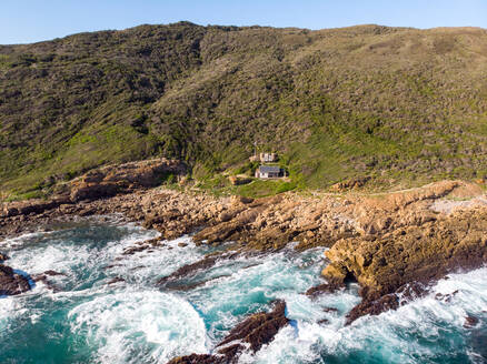 Aerial view of Robberg isolated beach hut at the sea, Western Cape, South Africa - AAEF11694