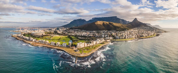 Panoramic aerial view of Lion‚Äôs Head, Green Point Stadium, Table Mountain and Mouille Point Lighthouse in summer from Atlantic Seaboard Sea Point Cape Town, South Africa - AAEF11698