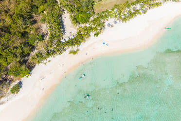 Aerial view of beach on tropical island of Malcapuya, Palawan, Philippines. - AAEF11773