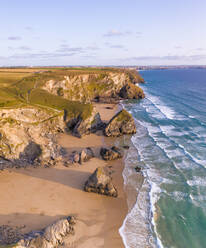 AERIAL view of Bedruthan Steps at sunset, St Eval, Cornwall, UK - AAEF11815