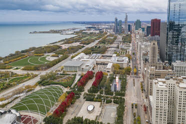 Aerial view of Jay Pritzker Pavillon near Millenium Park with Chicago downtown in foreground along Michigan Lake, Chicago, Illinois, United States. - AAEF11935