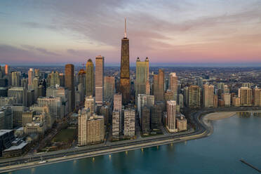 Aerial view of Chicago skyline at sunset with the Observatory building in foreground facing the Lake Michigan, Chicago, Illinois, United States. - AAEF11940