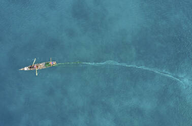 Aerial view of fishermen in a pirogue, fishing for mackerel, Mah√©,  Seychelles. stock photo