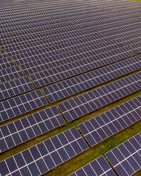 Aerial view of Solar panels in a solar field in Micco, Sebastian, Florida, United States. - AAEF12039