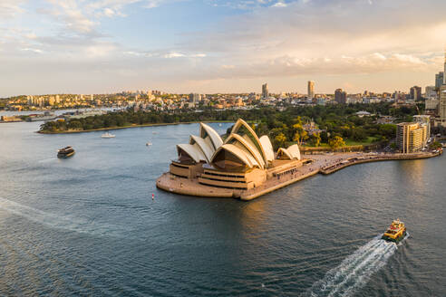 Aerial view of Sydney Opera House, a famous Australian landmark and public theatre in Sydney downtown at sunset, New South Wales, Australia. - AAEF12209