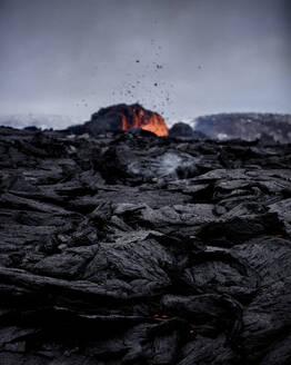 View of a crater and fresh lava flowing from volcano eruption in Geldingadalur, Iceland. - AAEF12276