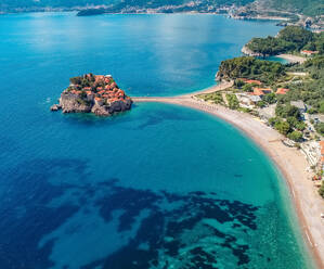 Aerial view of Sveti Stefan beautiful luxury island Budva, Montenegro - AAEF12534