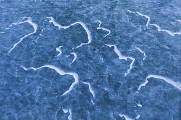 Aerial view of blue ice pattern on frozen lake in Spring time, Kaunas, Lithuania. - AAEF12819