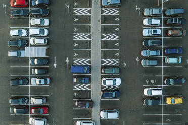 Aerial top down view of vehicles in parking lot from above, Kaunas, Lithuania. - AAEF12891