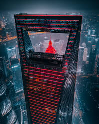 Aerial view of IFC and Jin Mao tower with the lights on in Shanghai, China. - AAEF13029