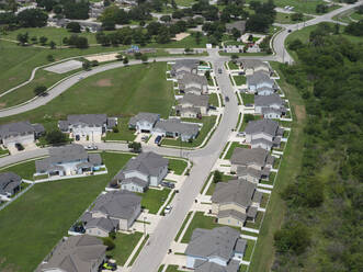 USA, Texas, San Antonio, Aerial view of suburban homes in summer - BCDF00598