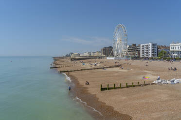View of beach front houses and ferris wheel from the pier, Worthing, West Sussex, England, United Kingdom, Europe - RHPLF20555