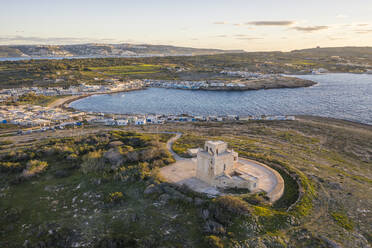 Malta, Northern Region, Mellieha, Aerial view of Ahrax Tower and Armier Bay at dusk - TAMF03187