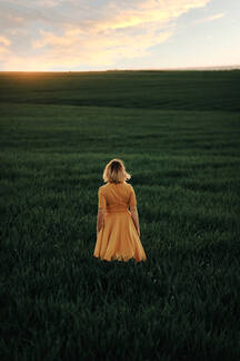 Young Beautiful Hipster Woman Standing On Field In The Countrysi