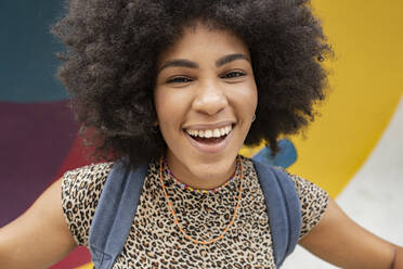 Cheerful young woman with black Afro hairstyle - JCCMF03671