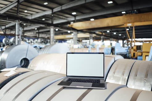 Laptop on manufactured metal sheet in industry - GUSF06166