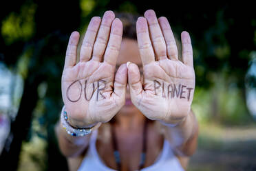 Woman showing message on palms - SIPF02340