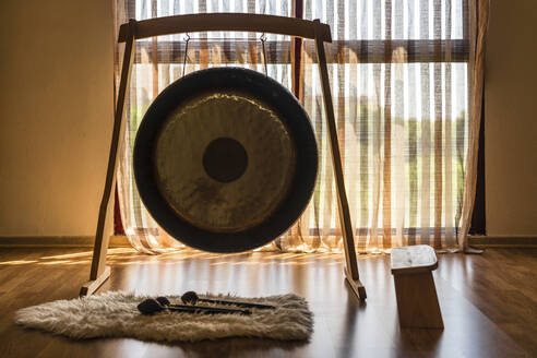 Gong with stool and mallets in studio - DLTSF02141
