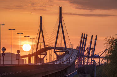 Germany, Hamburg, Kohlbrand Bridge at moody sunset - RJF00883