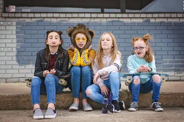 Group of Tween Girls hanging out in the city having fun. stock photo