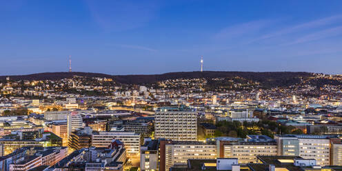 Germany, Baden-Wurttemberg, Stuttgart, Panorama of city downtown at dusk - WDF06606