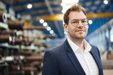 Businessman with eyeglasses at steel industry - JOSEF05662