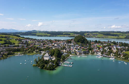 Austria, Salzburg, Mattsee, Drone view of lakeshore town in summer - WWF05845