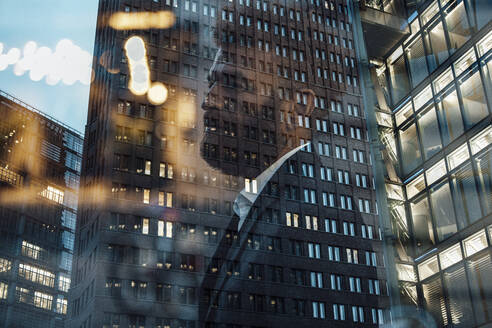 Double exposure of businessman and office building - GUSF06382