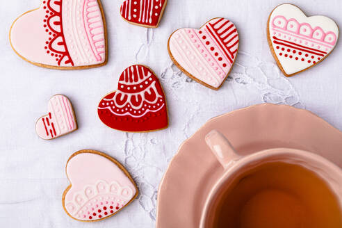 Studio shot of cup of tea and heart shaped cookies - FLMF00666