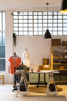 Empty desk in fashion design studio - GIOF13506