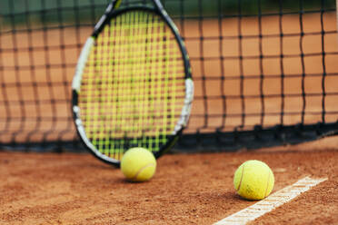 Tennis racket and ball at sports court - OYF00490