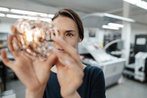 Female design professional checking 3D drone in industry - KNSF08988