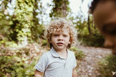 Cute boy with blond hair in forest - MRRF01545