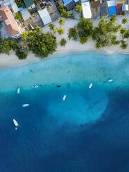 Maldives, Meemu Atoll, Mulah, Aerial view of coastline of inhabited island in Indian Ocean - KNTF06372
