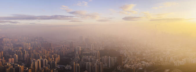 Hong Kong at sunrise with mist. - MINF16383